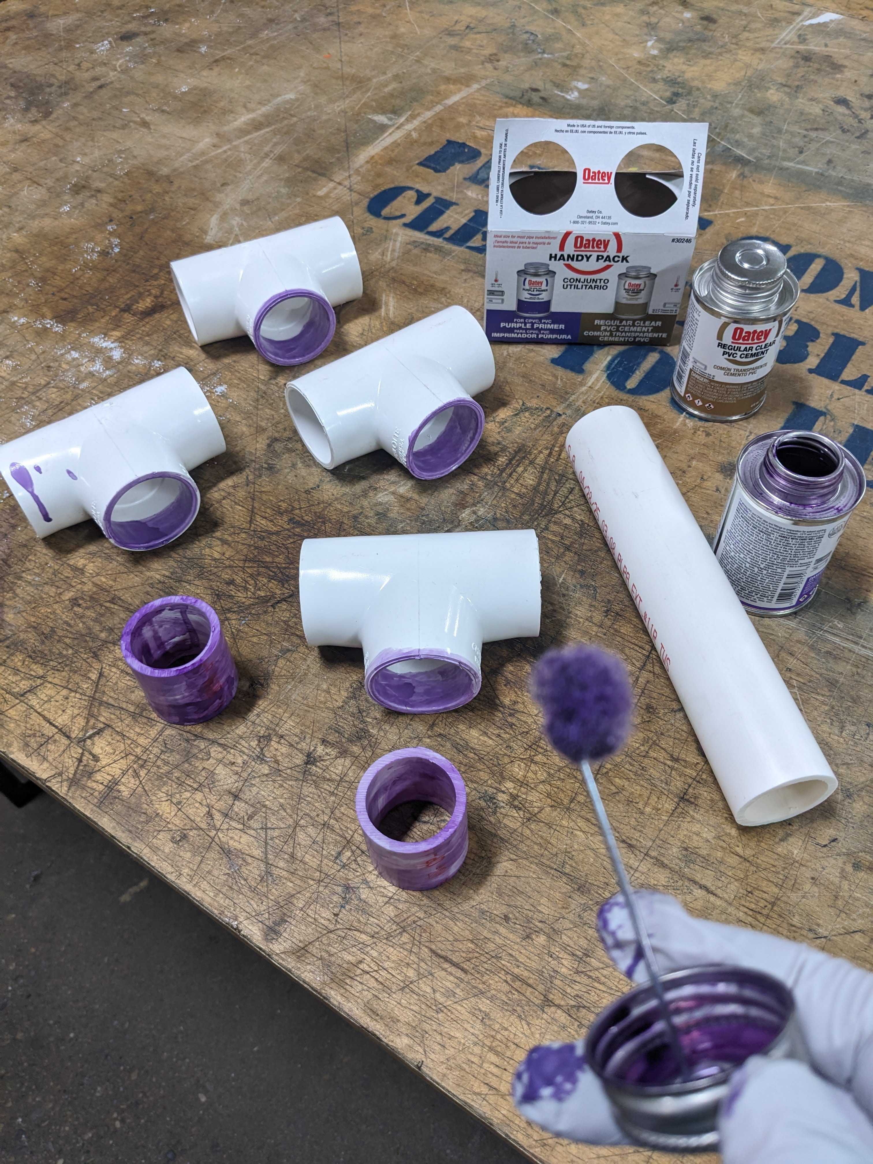 Applying PVC glue.