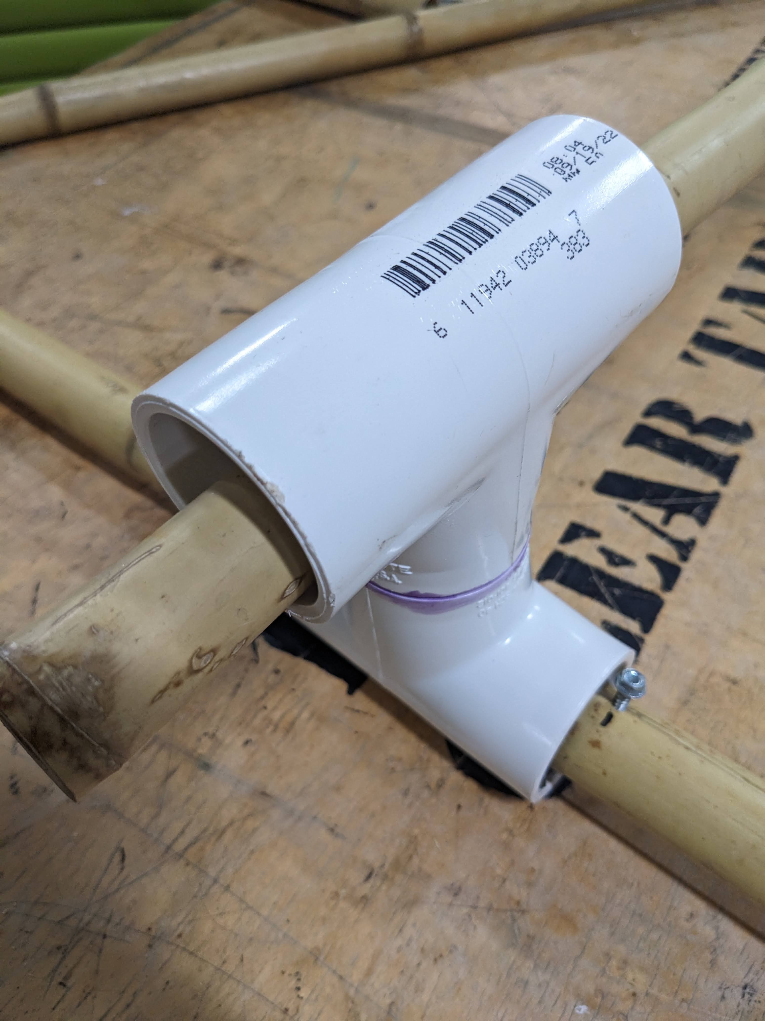 The bamboo spine will fit through the vertical PVC.