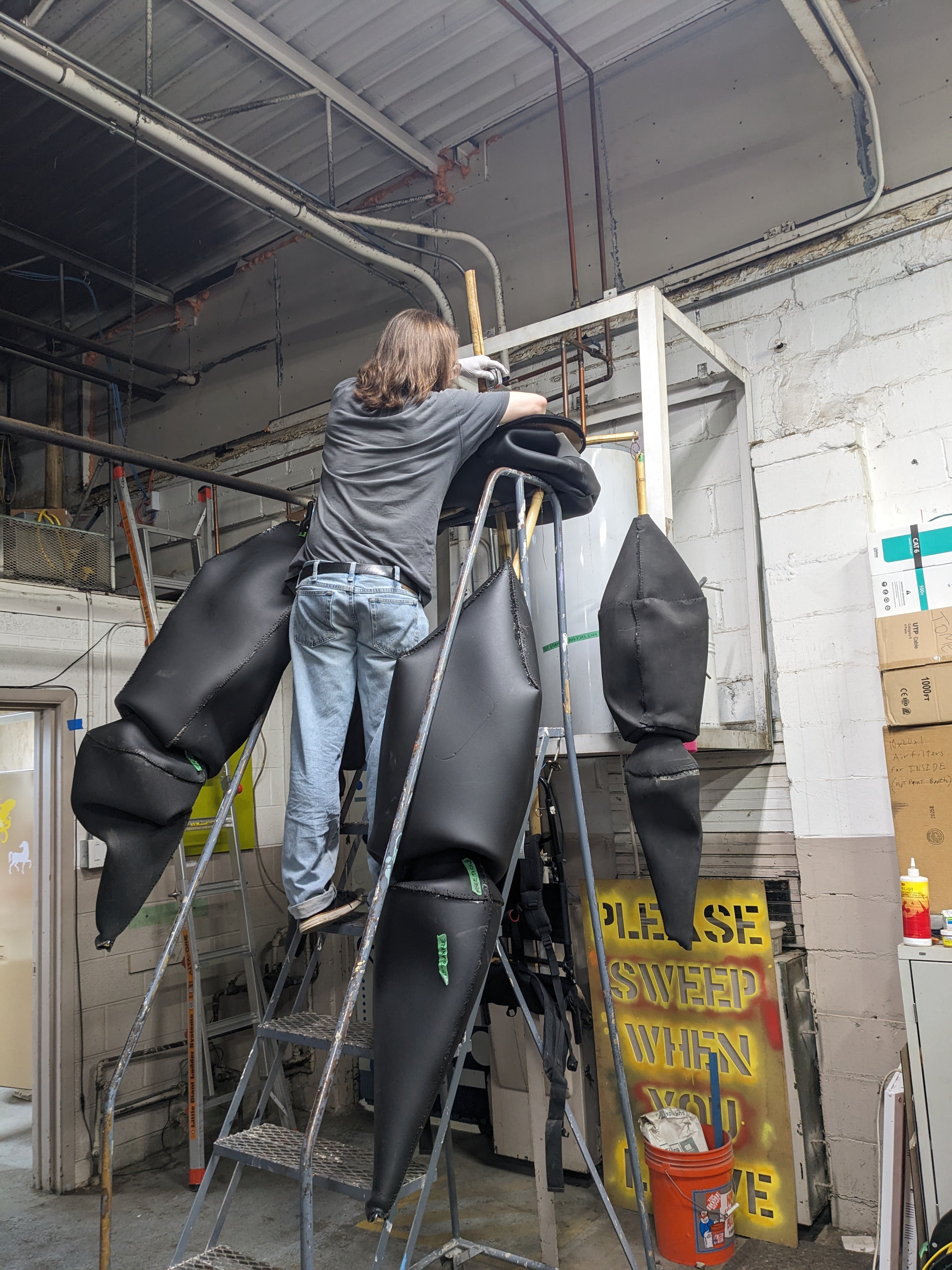 Lifting the pelvis, with legs attached, to the top of the spine, to slide it down into place.